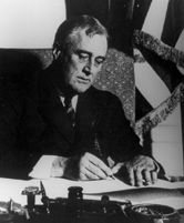 FDR signs Emergency Banking Act into law.