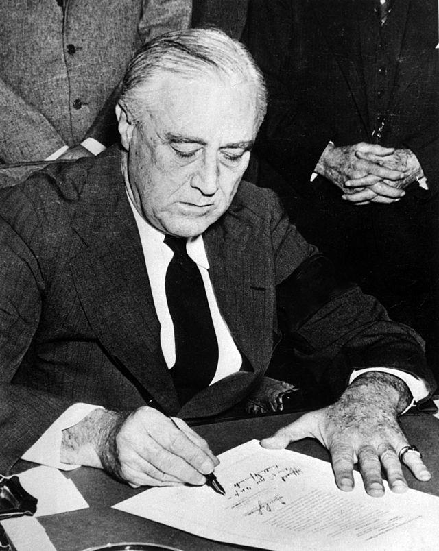 Roosevelt Signing a Declaration of War against Germany